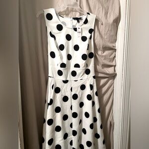 Sleeveless polka dot high and low dress